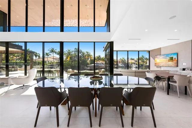 a living room with fireplace furniture and a large window