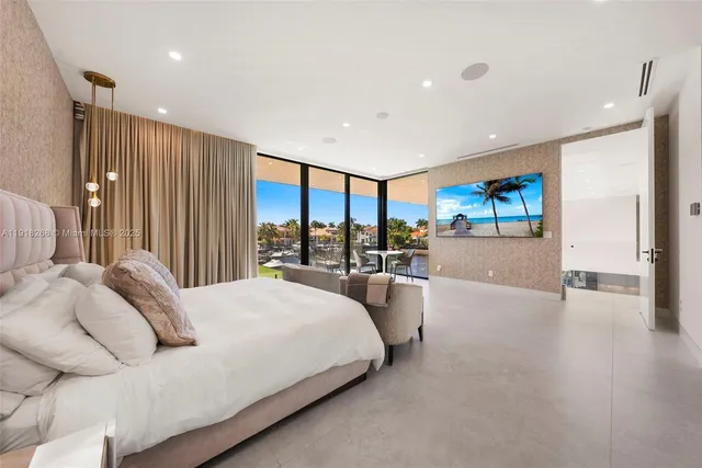 a spacious bedroom with a large window and a bed