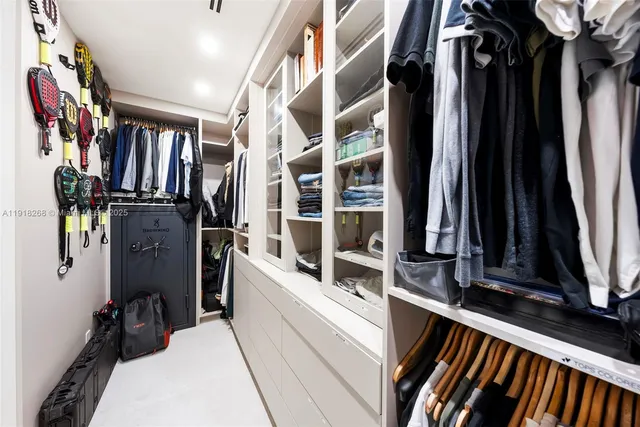 a view of a city from a dining room with furniture and window