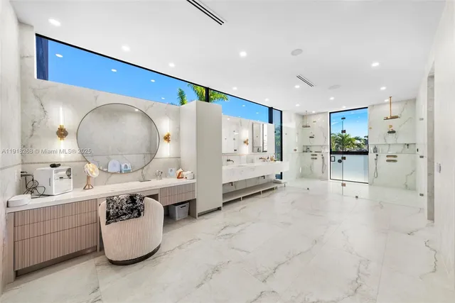 a bedroom with a large bed and a large window