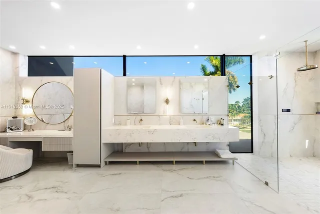 a bathroom with a sink a double vanity and a mirror