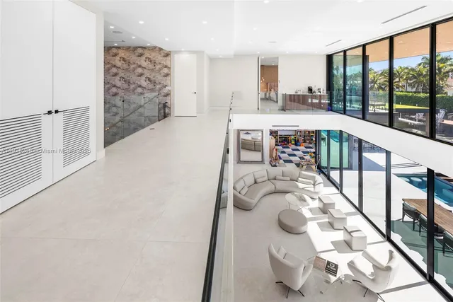 an aerial view of a city with lots of residential buildings lake and ocean view