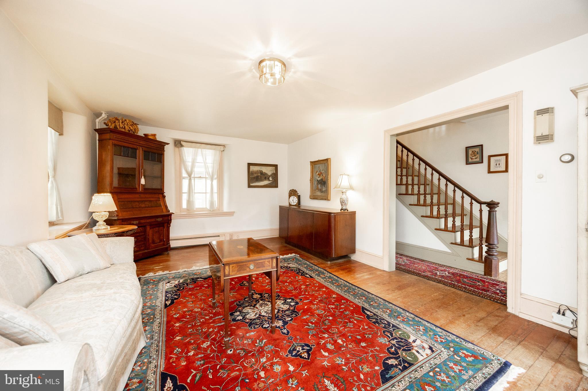 1699 Warpath Road West Chester, PA 19382 - Photo 11 of 65 a living room with furniture rug and wooden floor