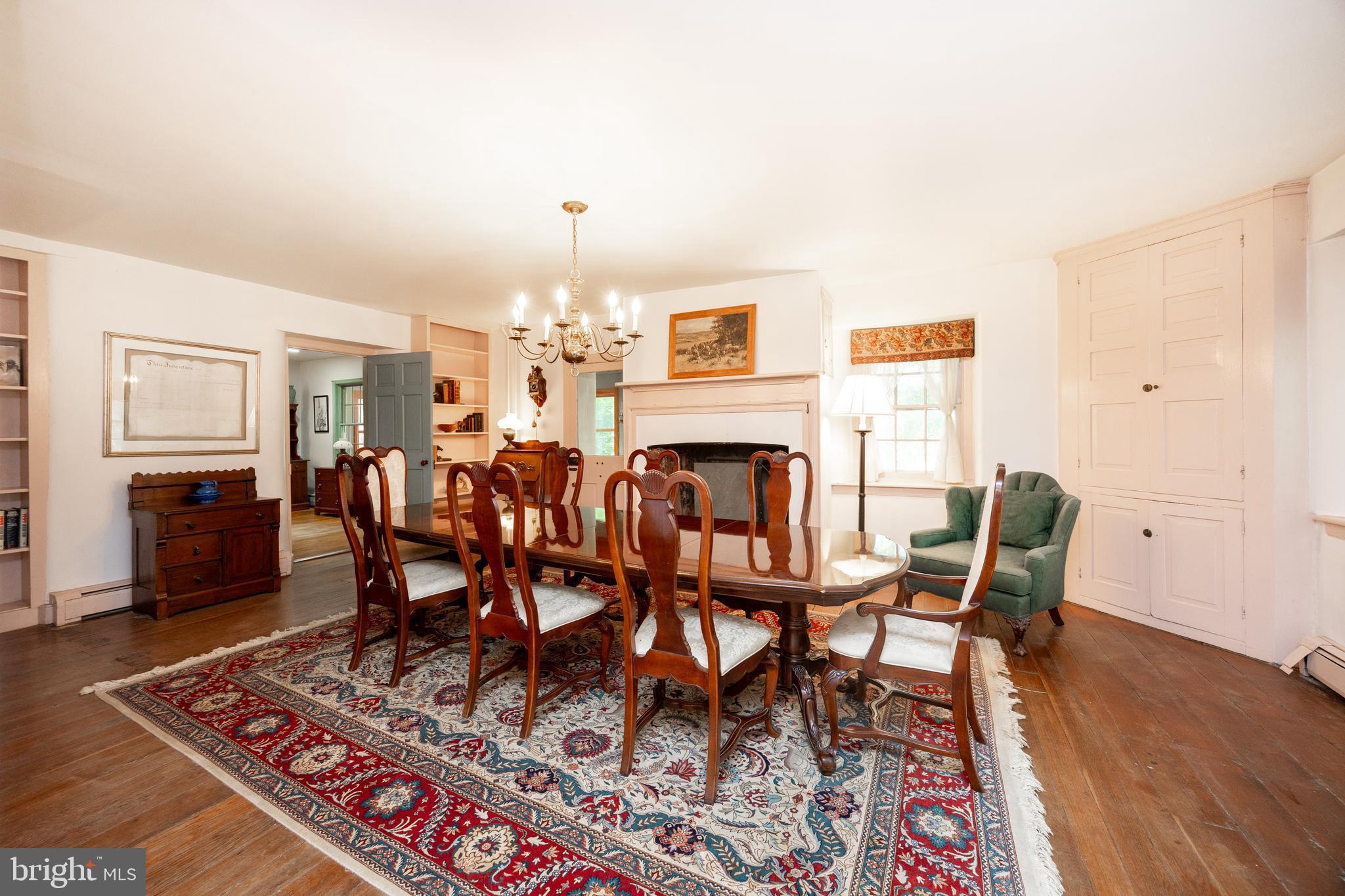 1699 Warpath Road West Chester, PA 19382 - Photo 12 of 65 a dining room with furniture a rug a rug and a chandelier