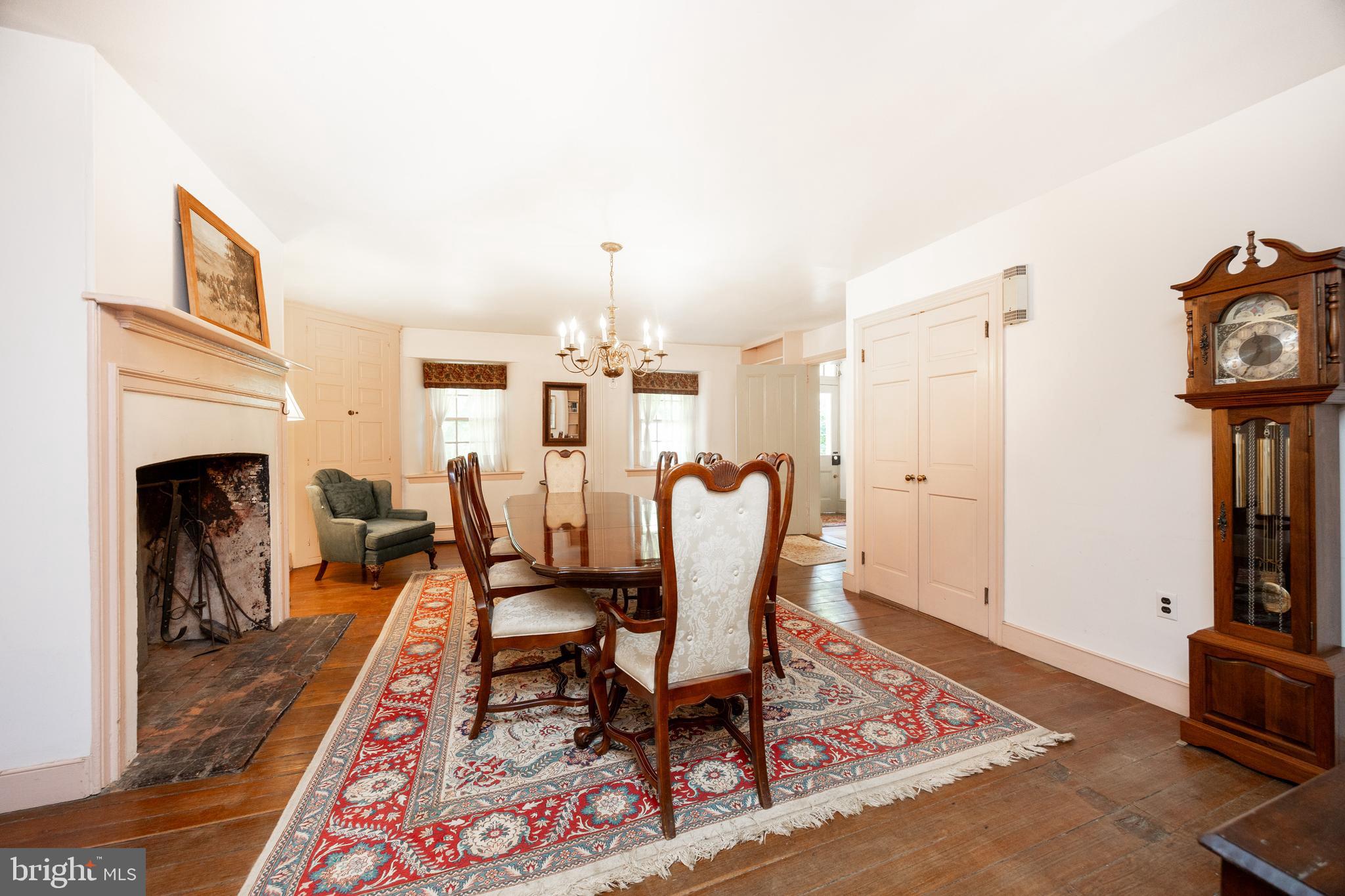 1699 Warpath Road West Chester, PA 19382 - Photo 13 of 65 a living room with furniture a fireplace and rug