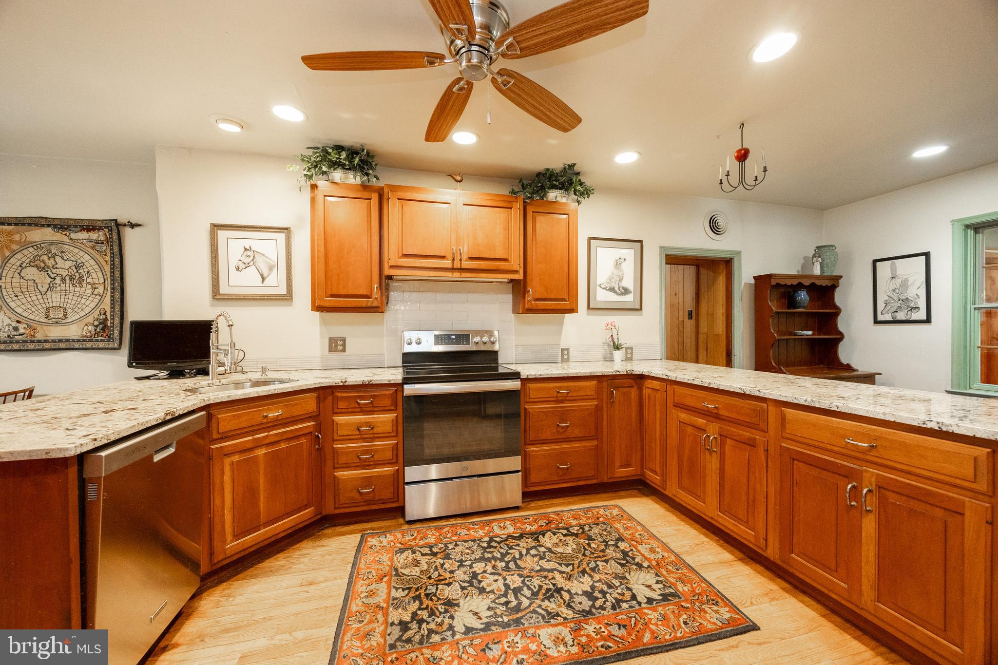 1699 Warpath Road West Chester, PA 19382 - Photo 14 of 65 a kitchen with stainless steel appliances granite countertop a sink stove and refrigerator