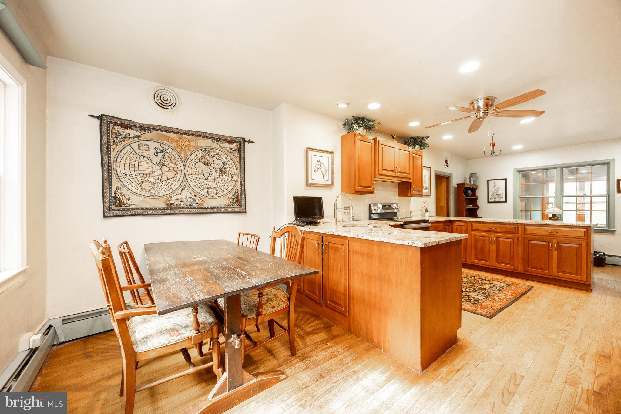 1699 Warpath Road West Chester, PA 19382 - Photo 17 of 65 a living room with stainless steel appliances kitchen island granite countertop furniture and a kitchen view
