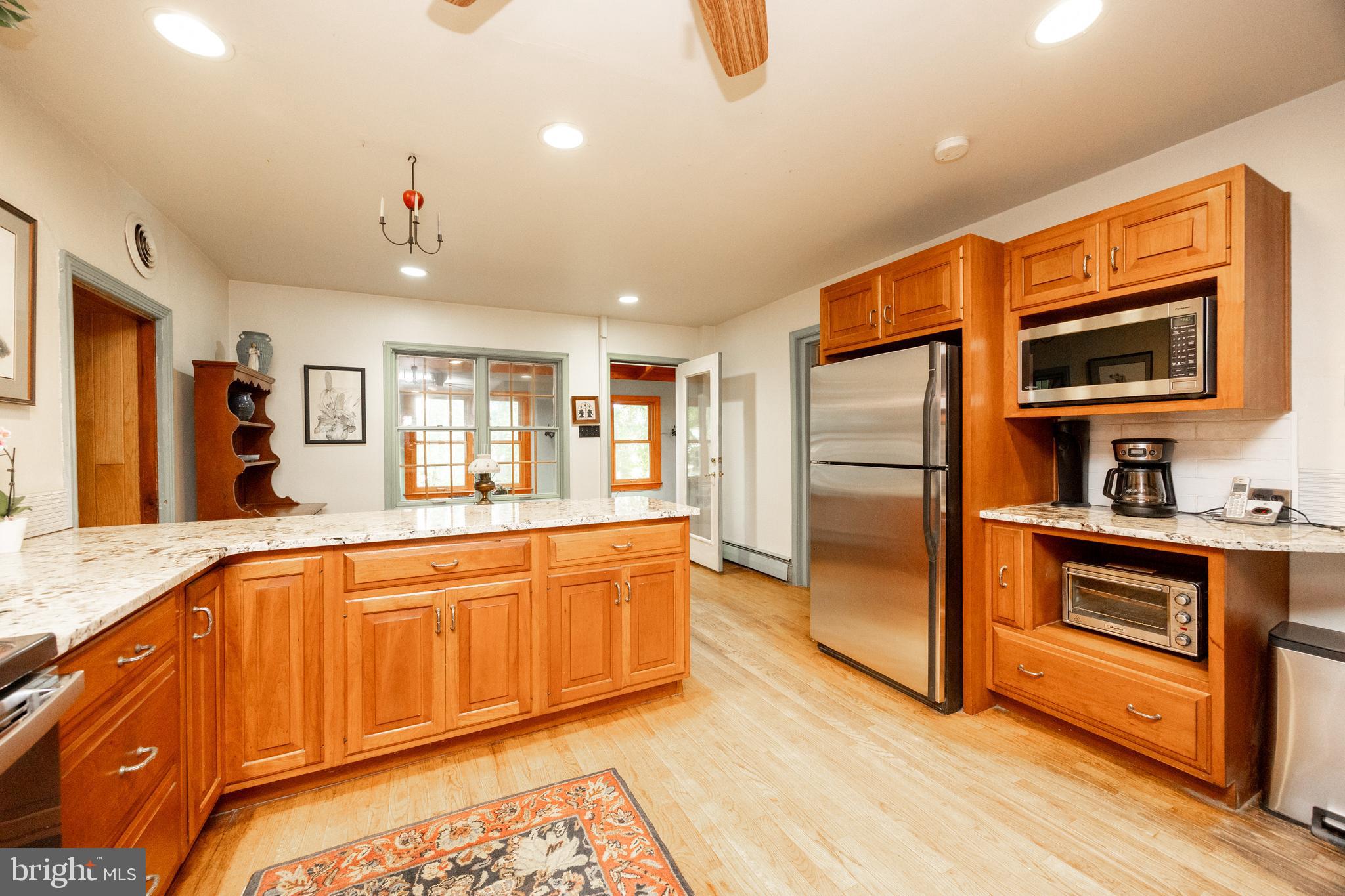1699 Warpath Road West Chester, PA 19382 - Photo 18 of 65 a large kitchen with stainless steel appliances granite countertop a refrigerator and a stove top oven