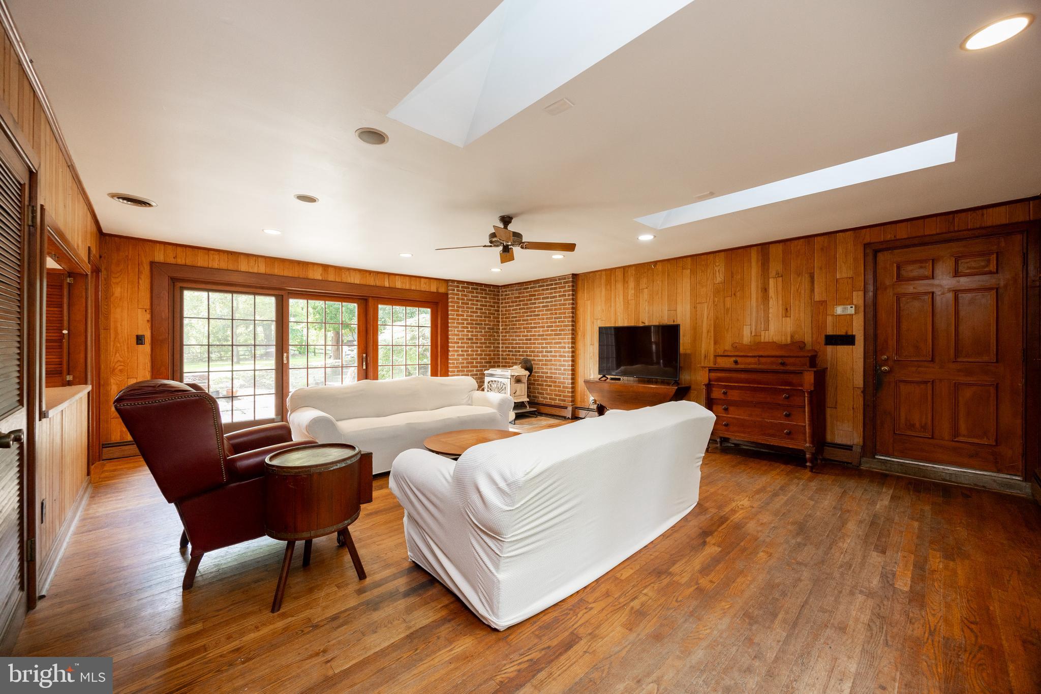 1699 Warpath Road West Chester, PA 19382 - Photo 23 of 65 a living room with furniture and a flat screen tv