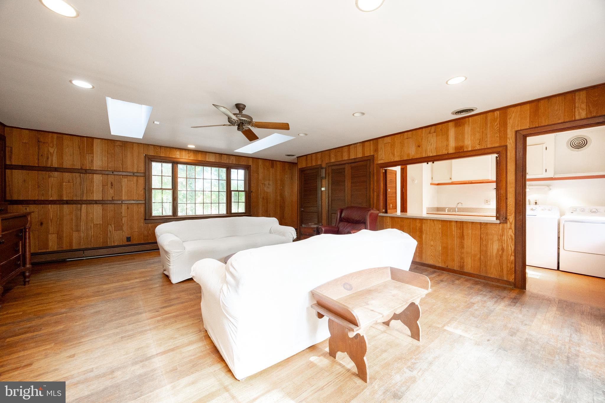 1699 Warpath Road West Chester, PA 19382 - Photo 24 of 65 a spacious bedroom with a large bed and a large window