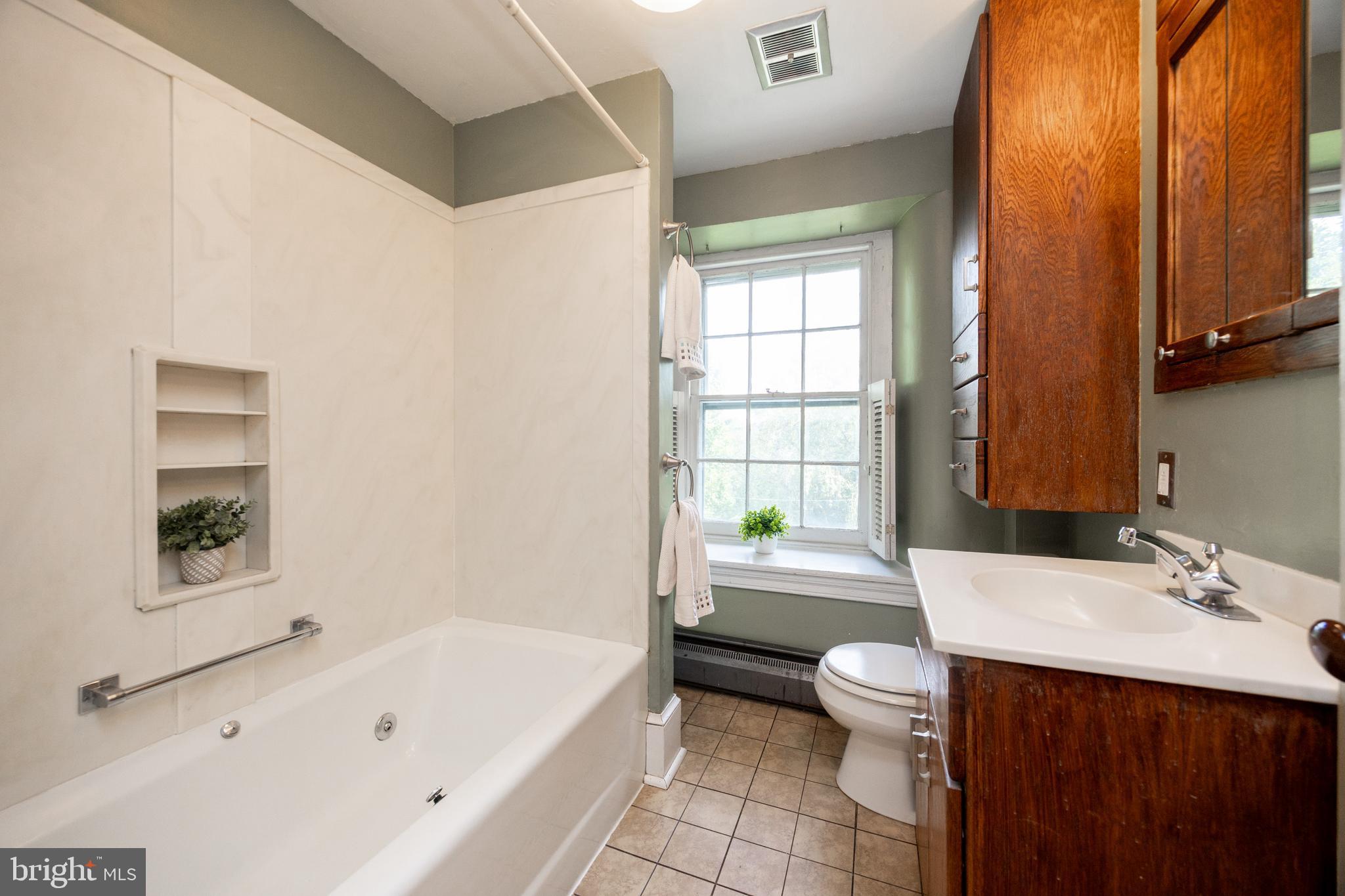 1699 Warpath Road West Chester, PA 19382 - Photo 32 of 65 a bathroom with a sink a toilet and a bathtub