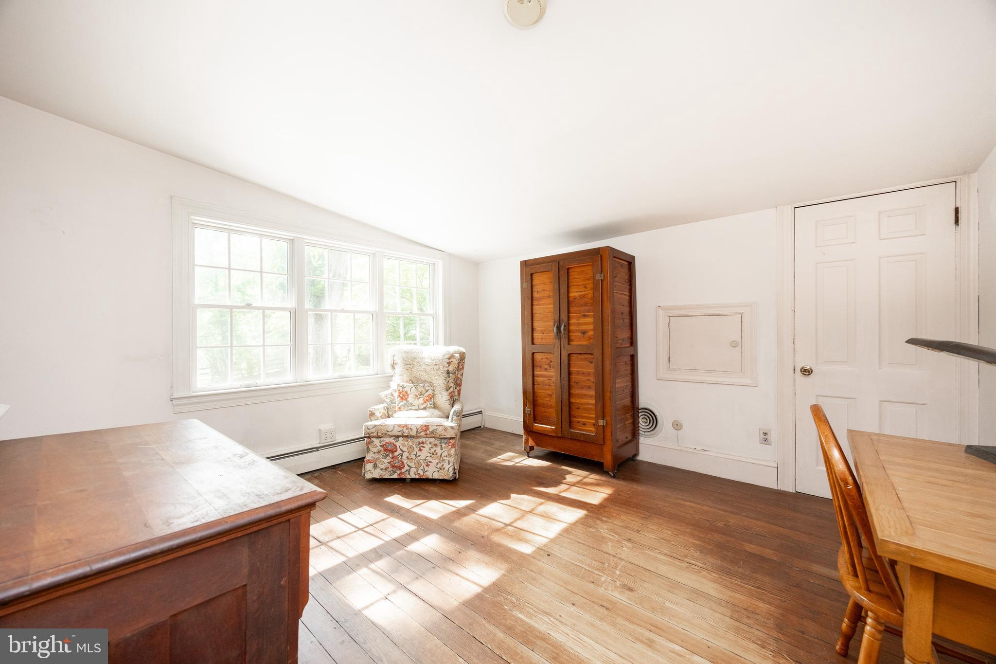 1699 Warpath Road West Chester, PA 19382 - Photo 36 of 65 a living room with furniture window and wooden floor