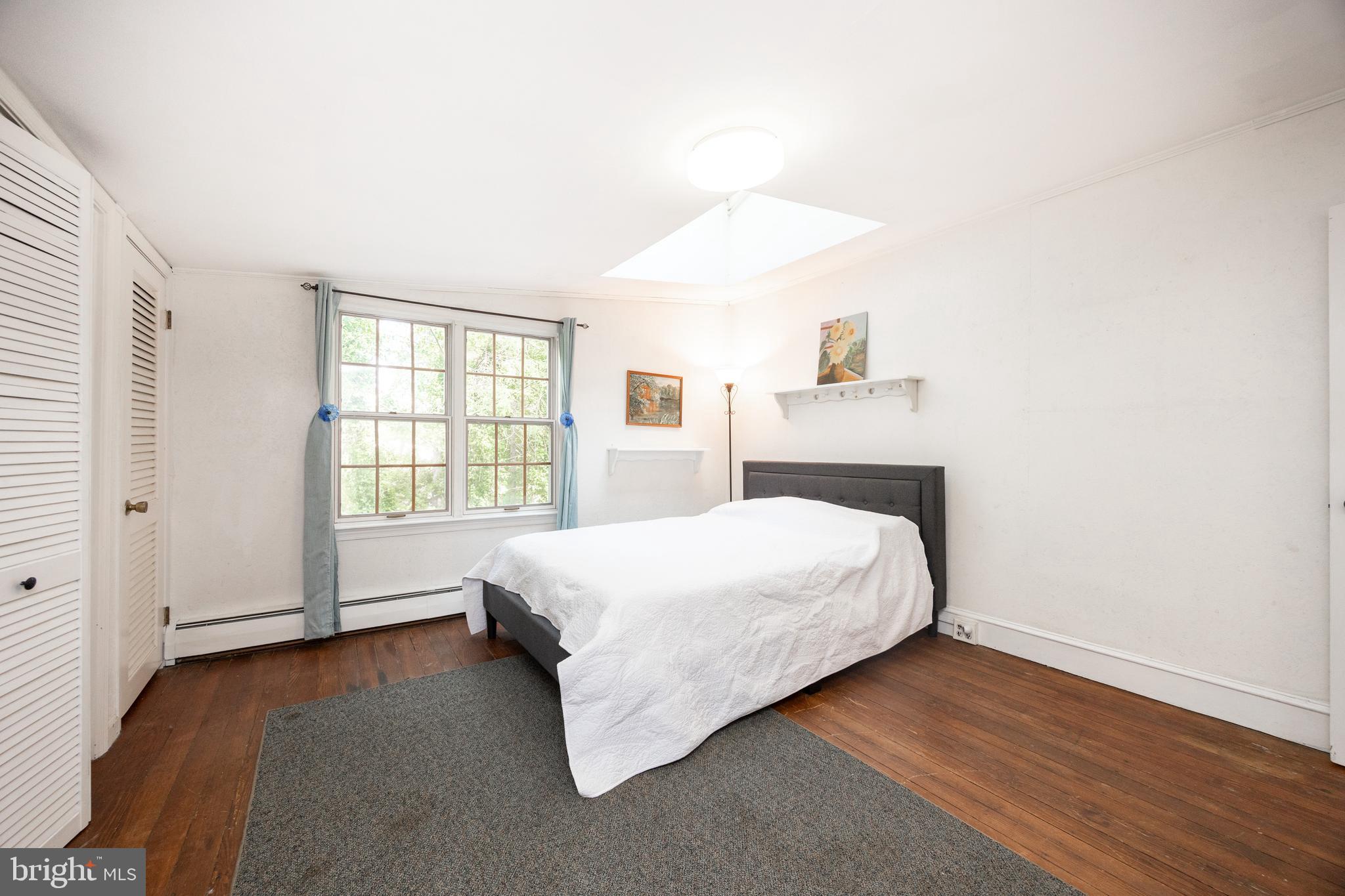1699 Warpath Road West Chester, PA 19382 - Photo 38 of 65 a bed sitting in a spacious bedroom next to a window