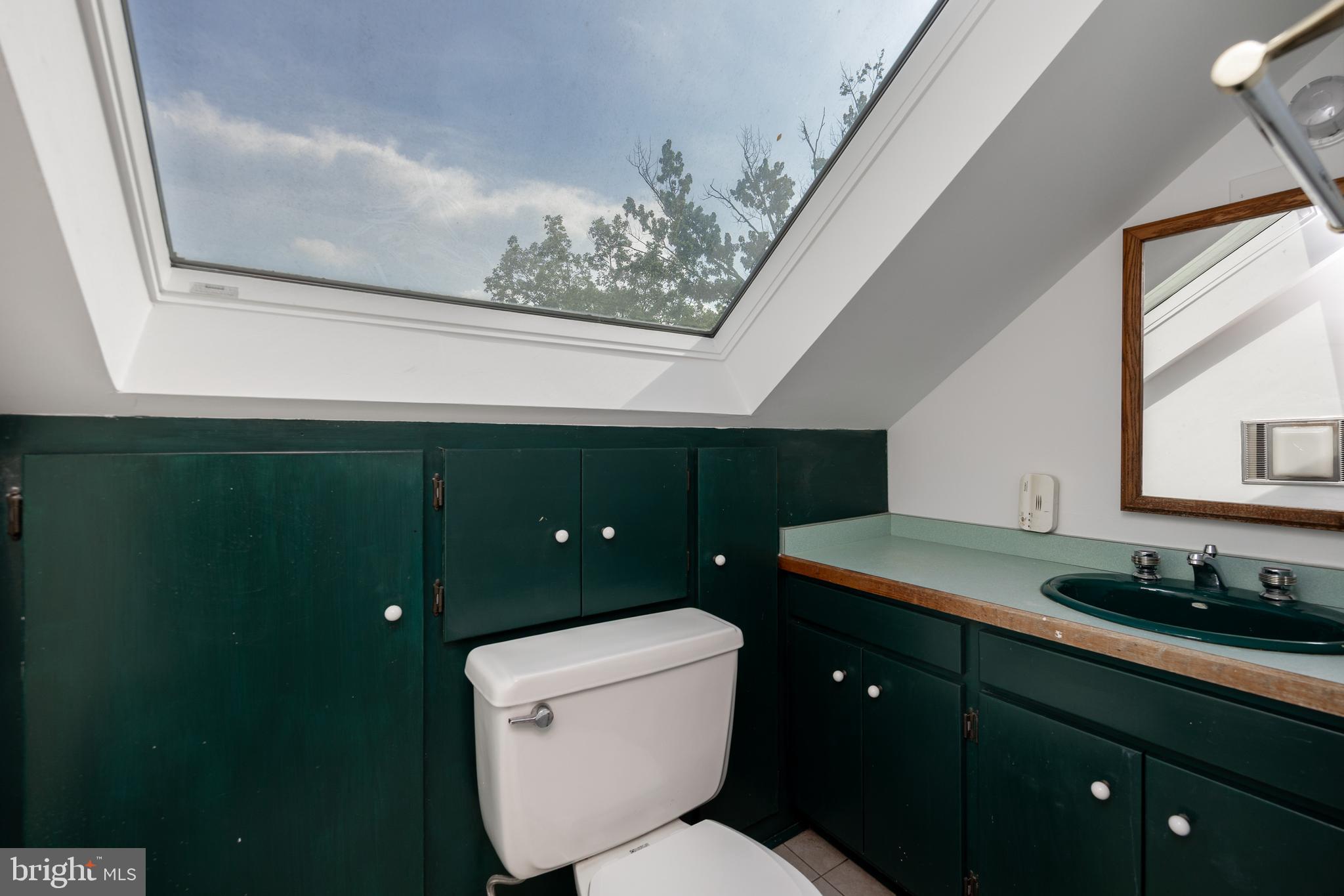 1699 Warpath Road West Chester, PA 19382 - Photo 41 of 65 a bathroom with a toilet sink and mirror