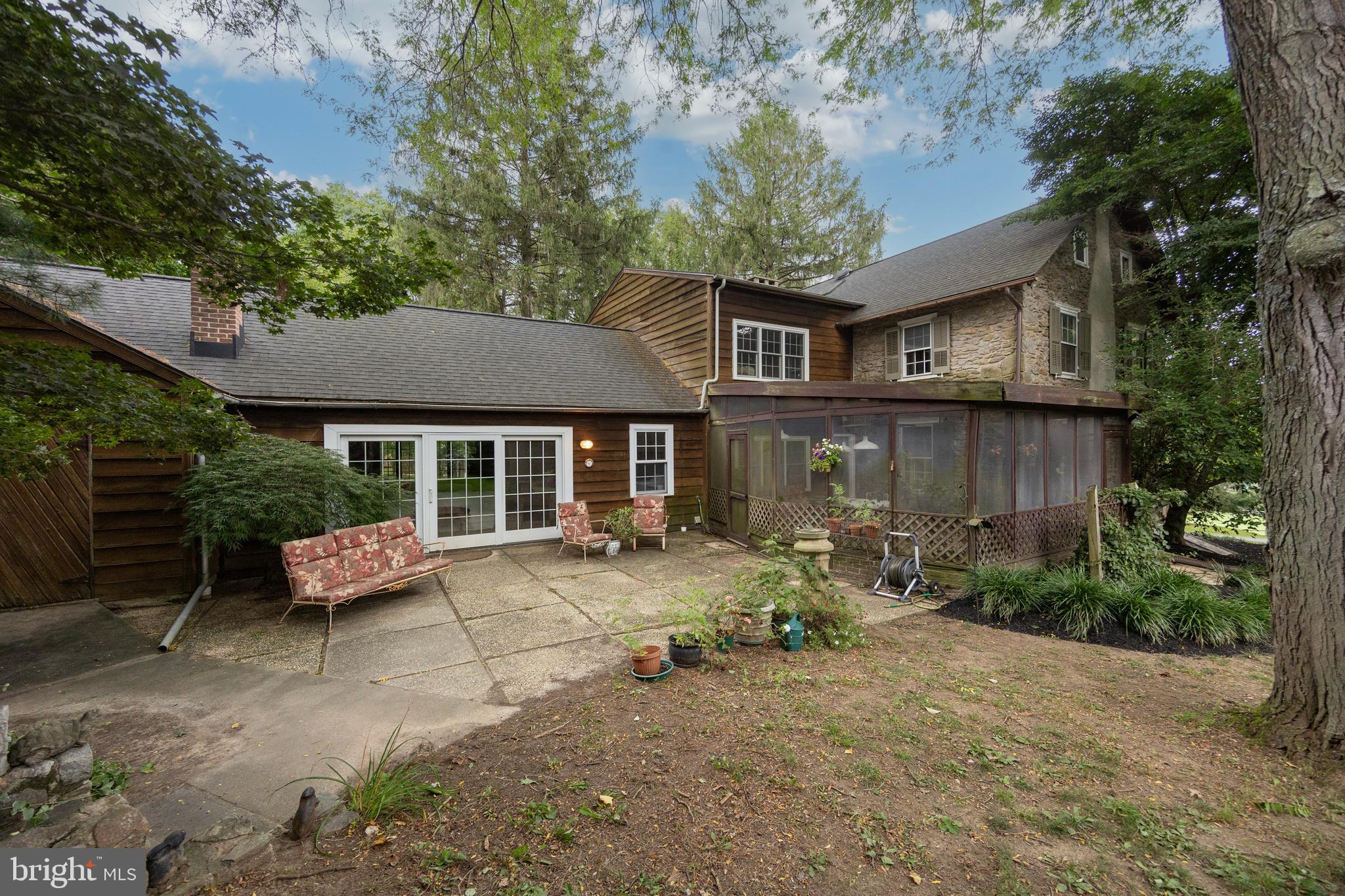 1699 Warpath Road West Chester, PA 19382 - Photo 45 of 65 a view of a house with backyard and sitting area