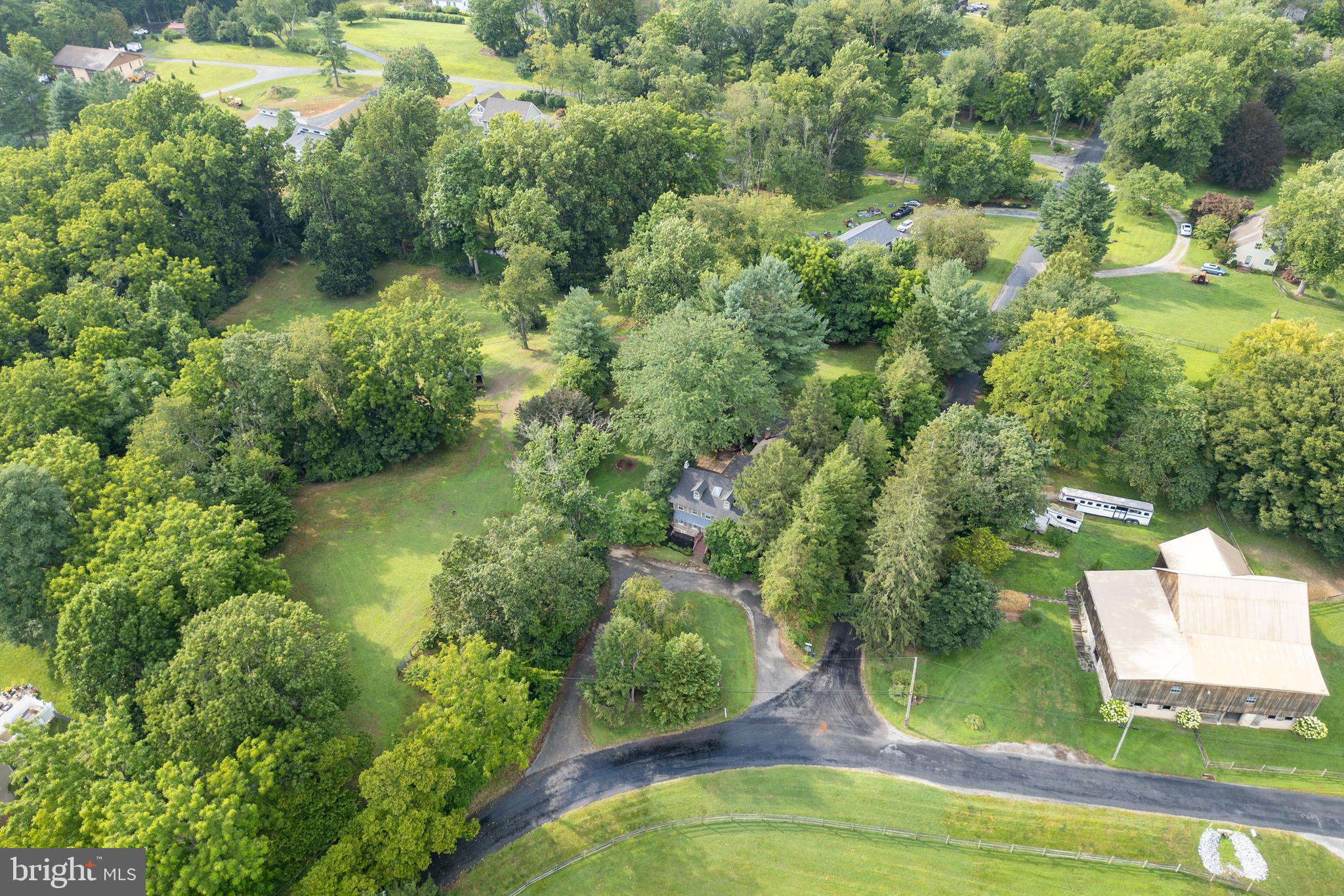 1699 Warpath Road West Chester, PA 19382 - Photo 64 of 65 an aerial view of residential houses with outdoor space and trees