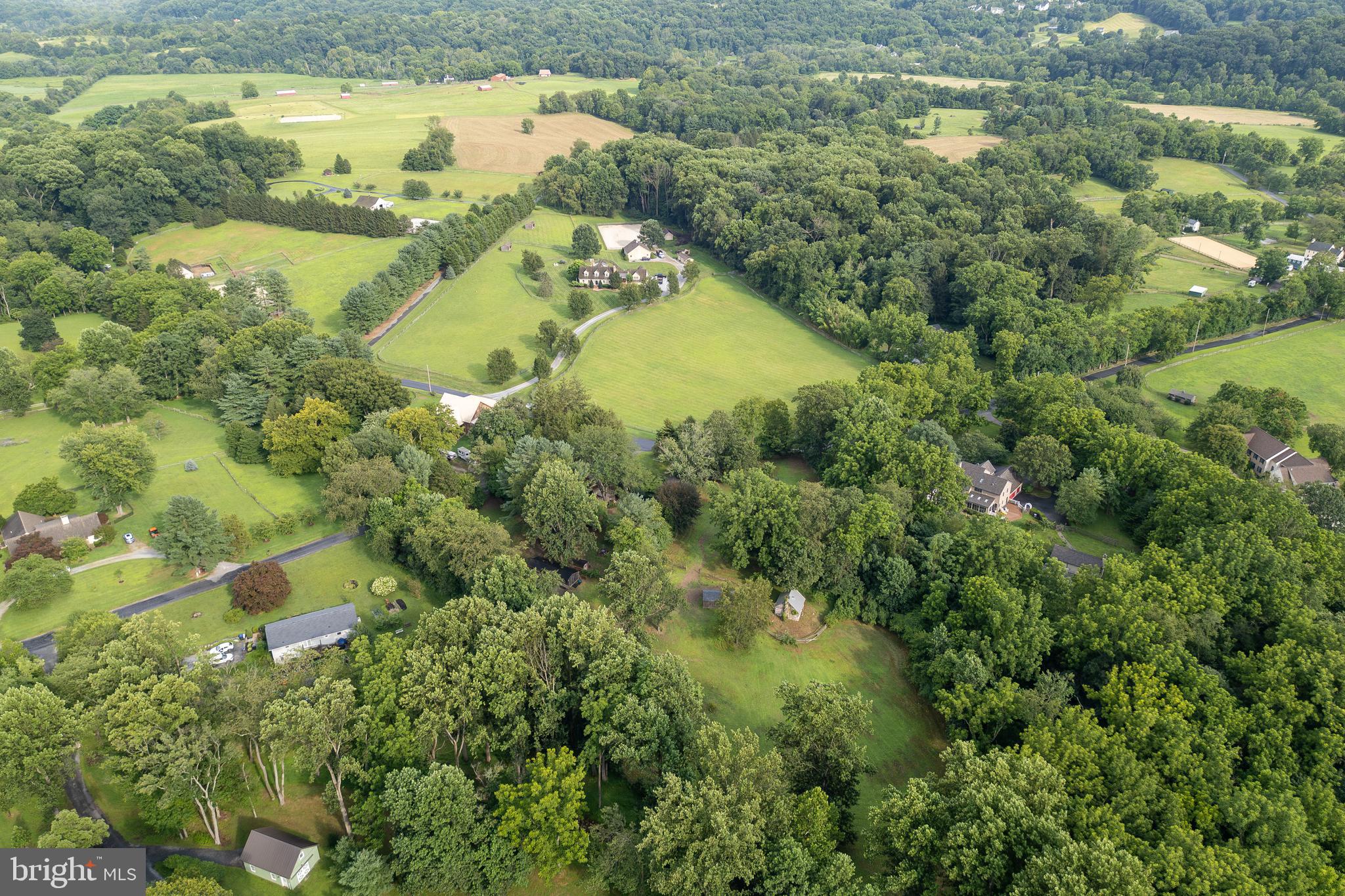 1699 Warpath Road West Chester, PA 19382 - Photo 65 of 65 an aerial view of residential houses with outdoor space and trees