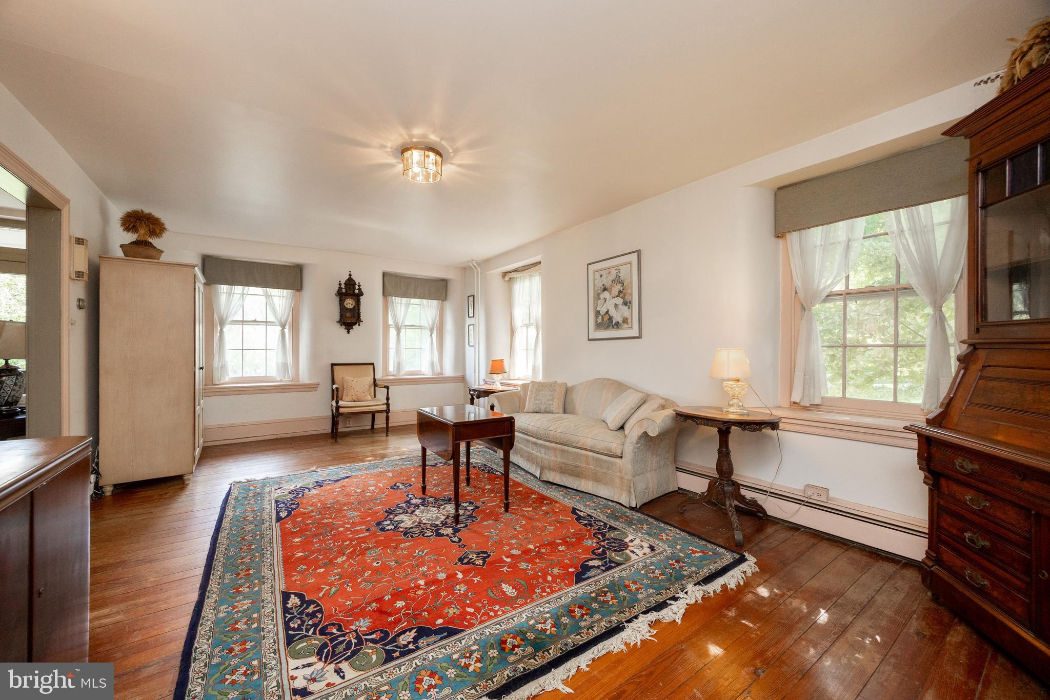 1699 Warpath Road West Chester, PA 19382 - Photo 10 of 65 a living room with furniture a rug and a window