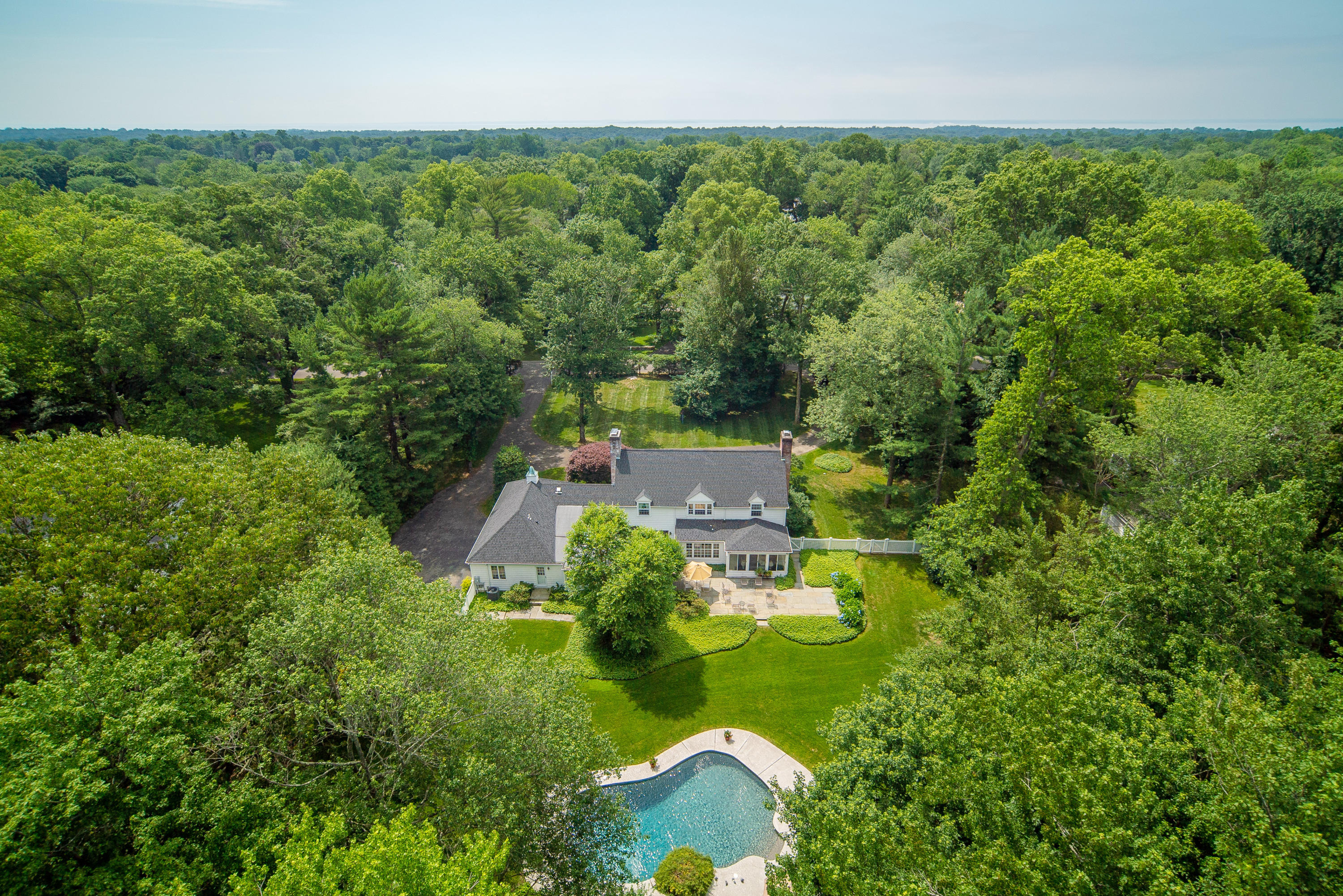 51 St Nicholas Road Darien, CT 06820 - Photo 1 of 34 an aerial view of residential house with outdoor space and trees all around