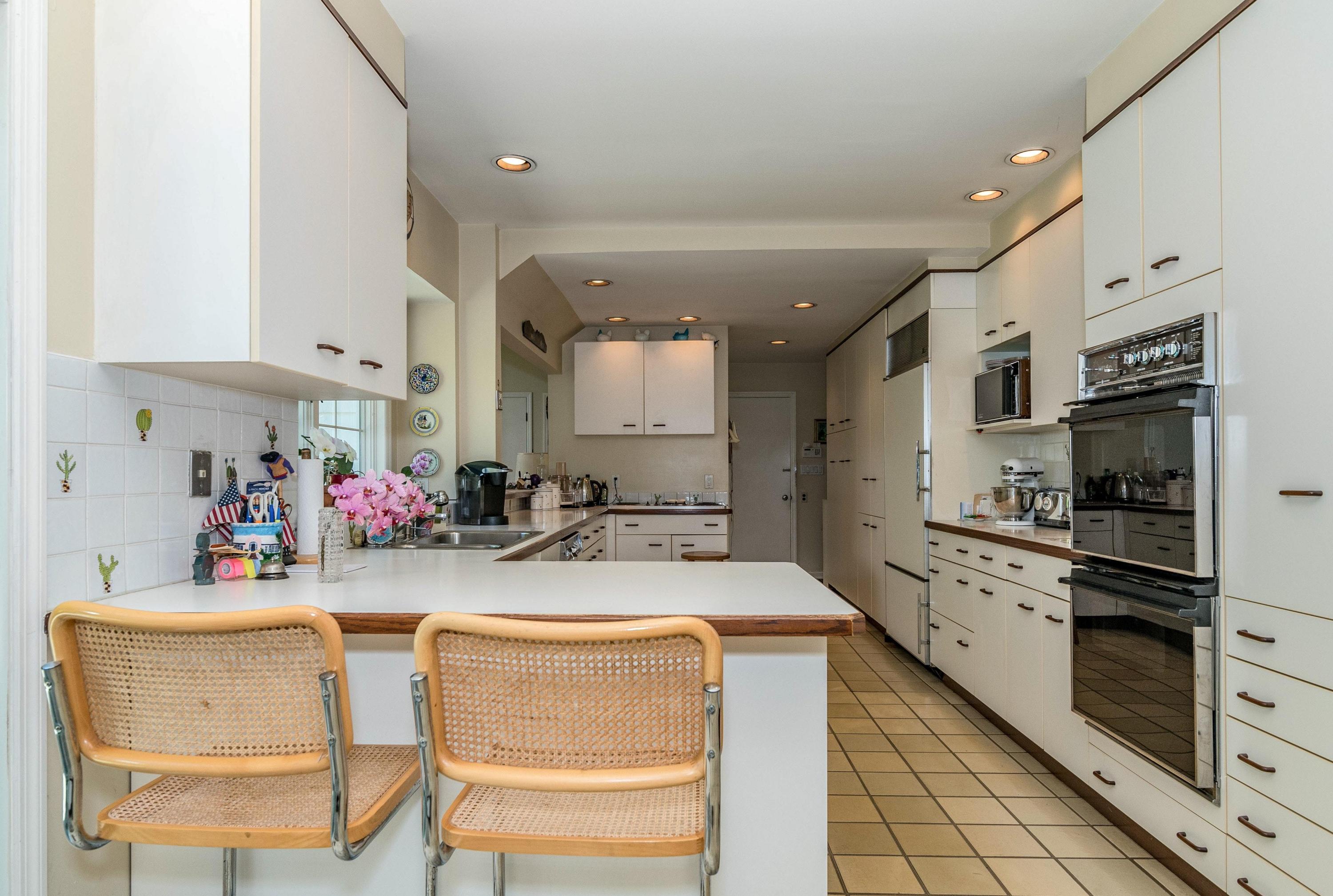51 St Nicholas Road Darien, CT 06820 - Photo 12 of 34 a kitchen with a sink appliances and cabinets