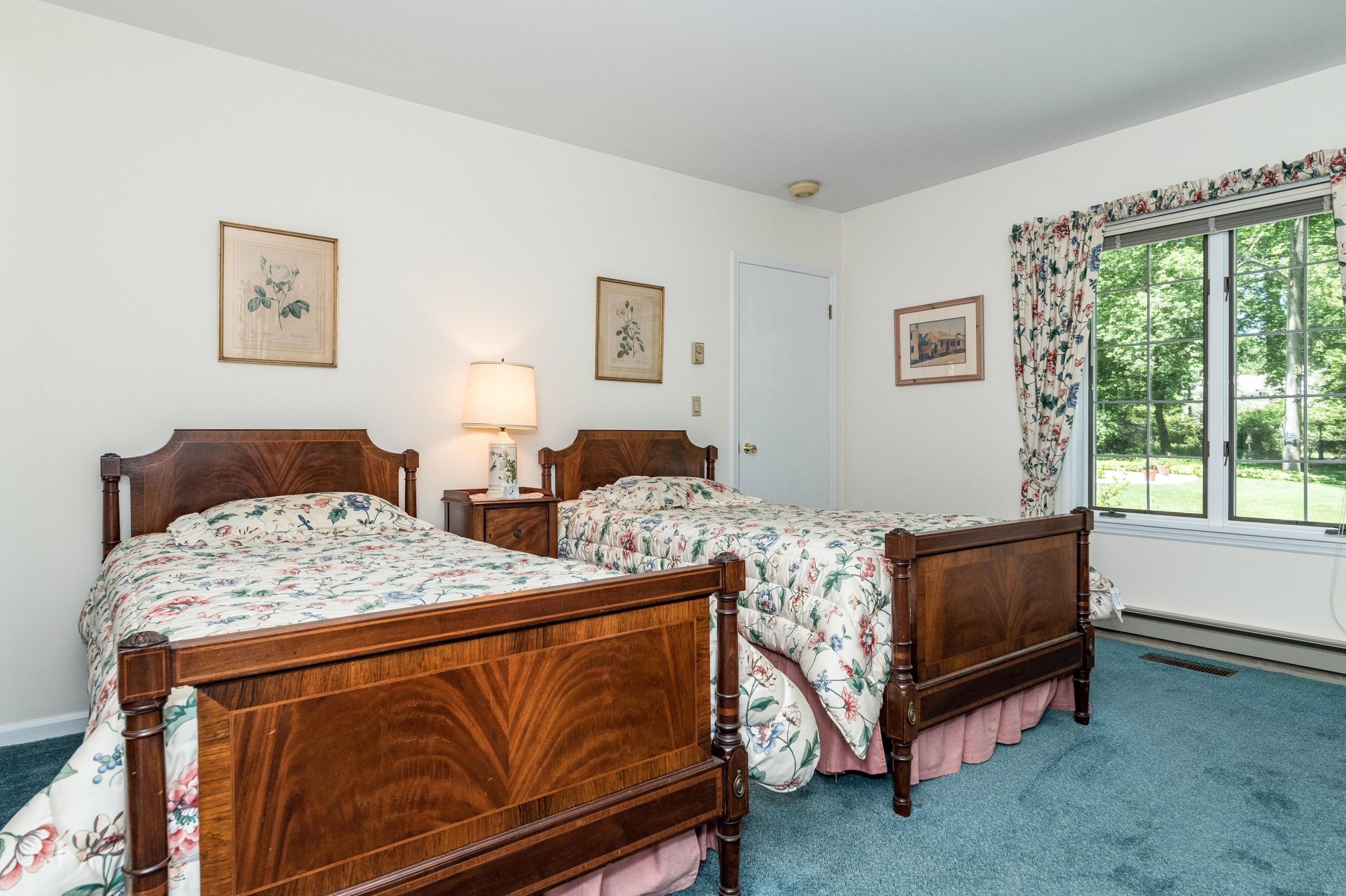 51 St Nicholas Road Darien, CT 06820 - Photo 19 of 34 a bedroom with two beds and a large window