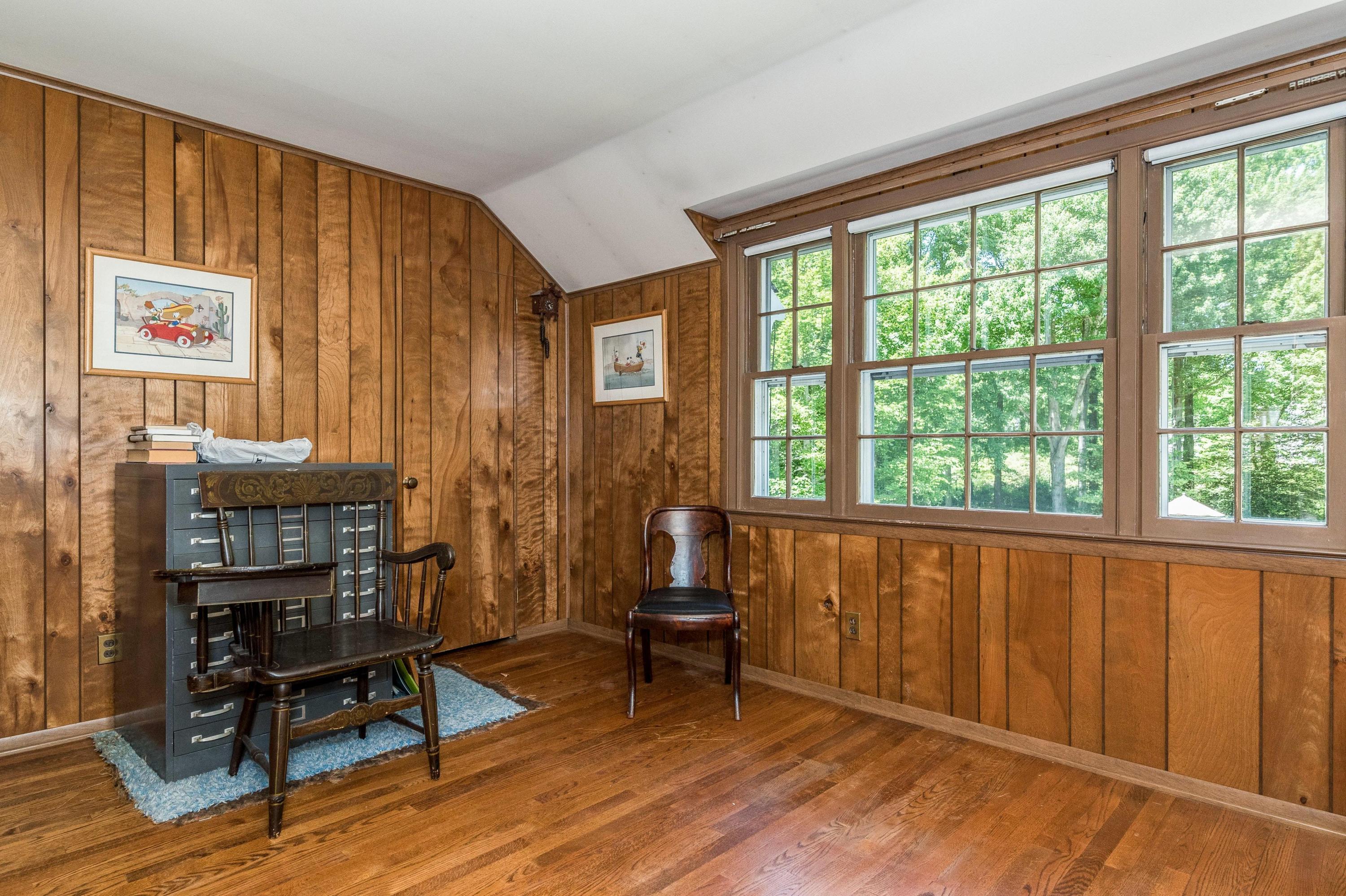 51 St Nicholas Road Darien, CT 06820 - Photo 26 of 34 a living room with furniture a window and a wooden floor
