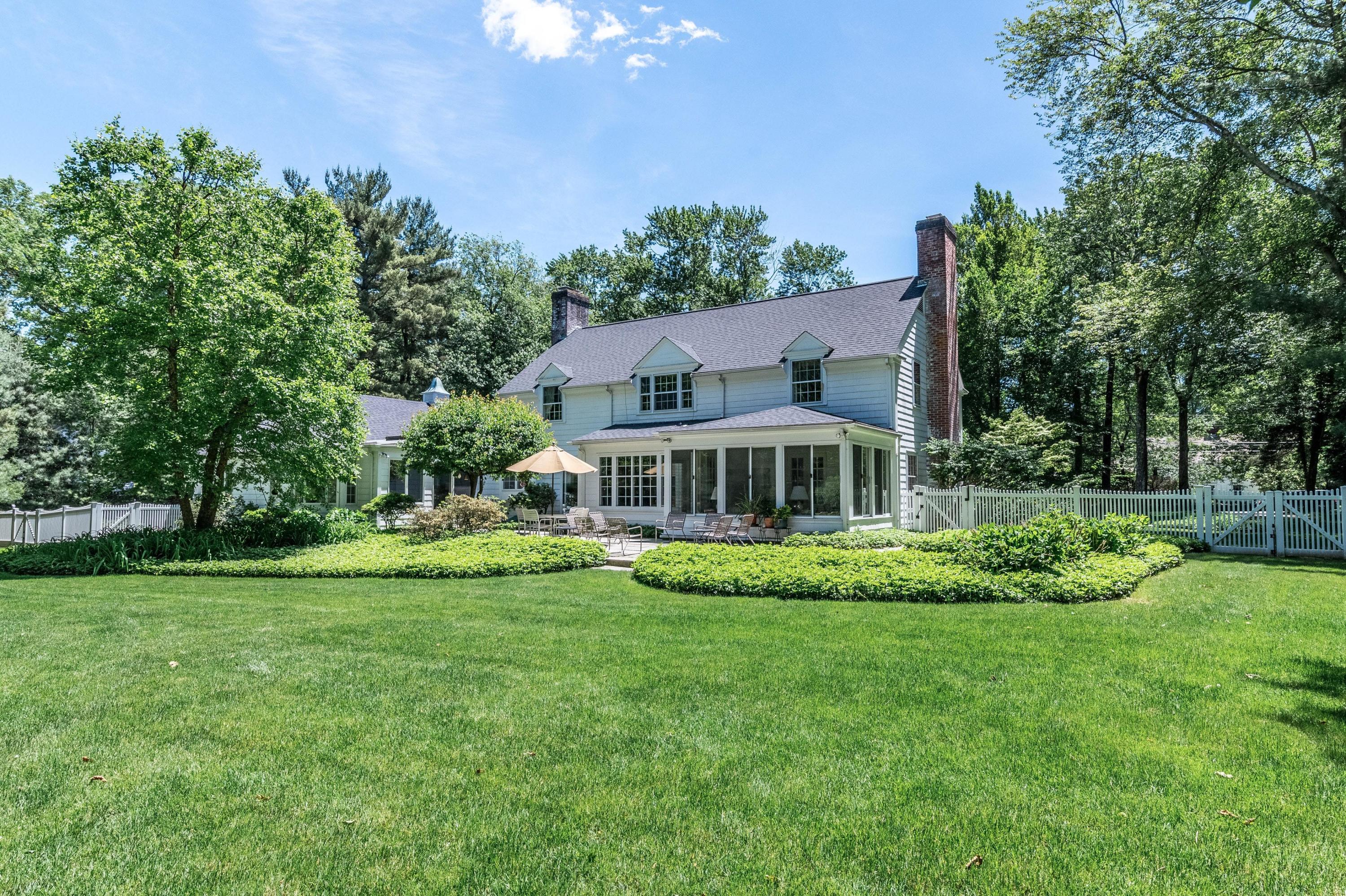 51 St Nicholas Road Darien, CT 06820 - Photo 31 of 34 a front view of a house with a garden