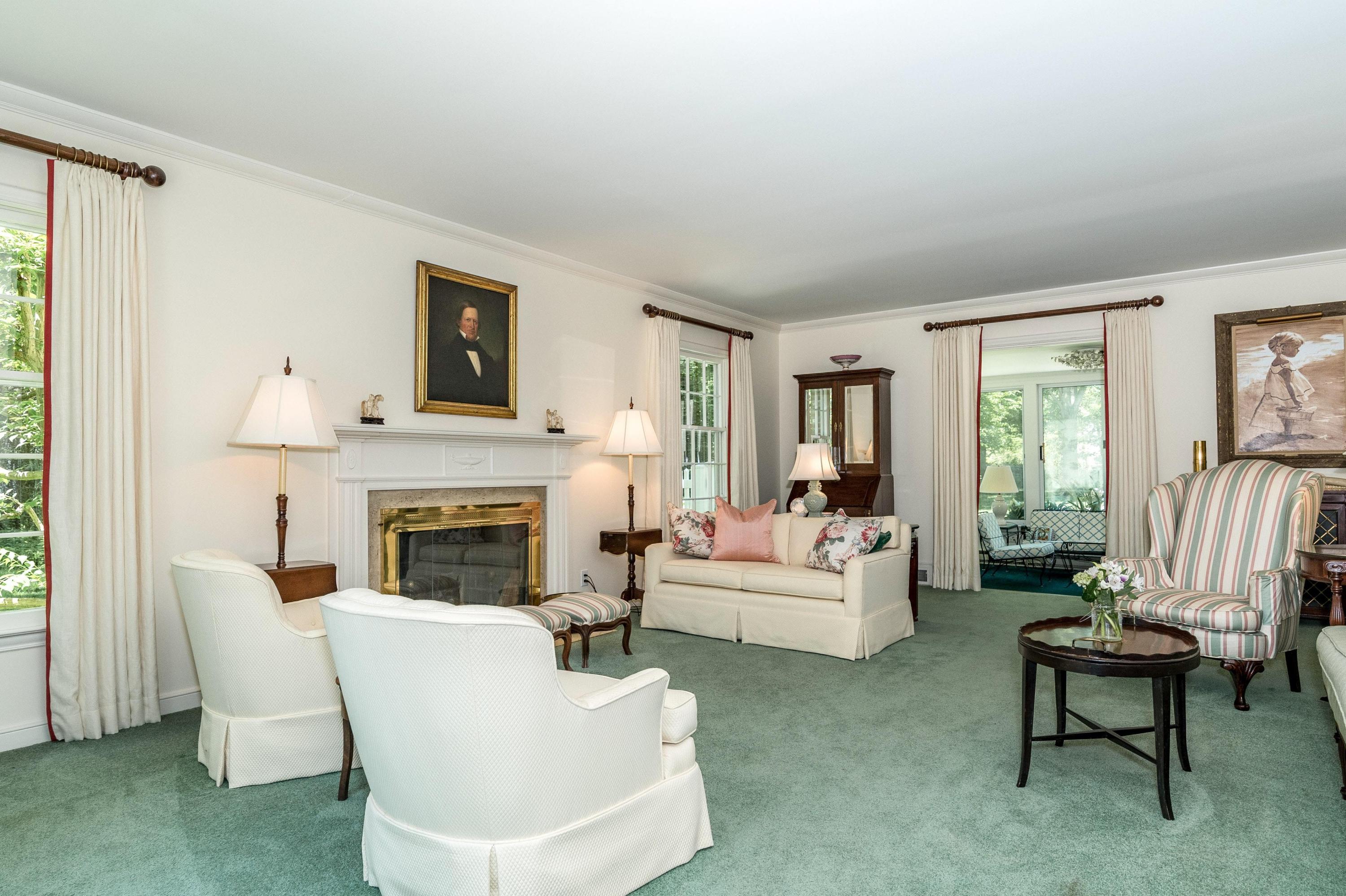 51 St Nicholas Road Darien, CT 06820 - Photo 7 of 34 a living room with furniture a fireplace and a large window