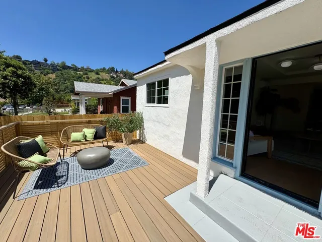 a view of house with patio outdoor seating