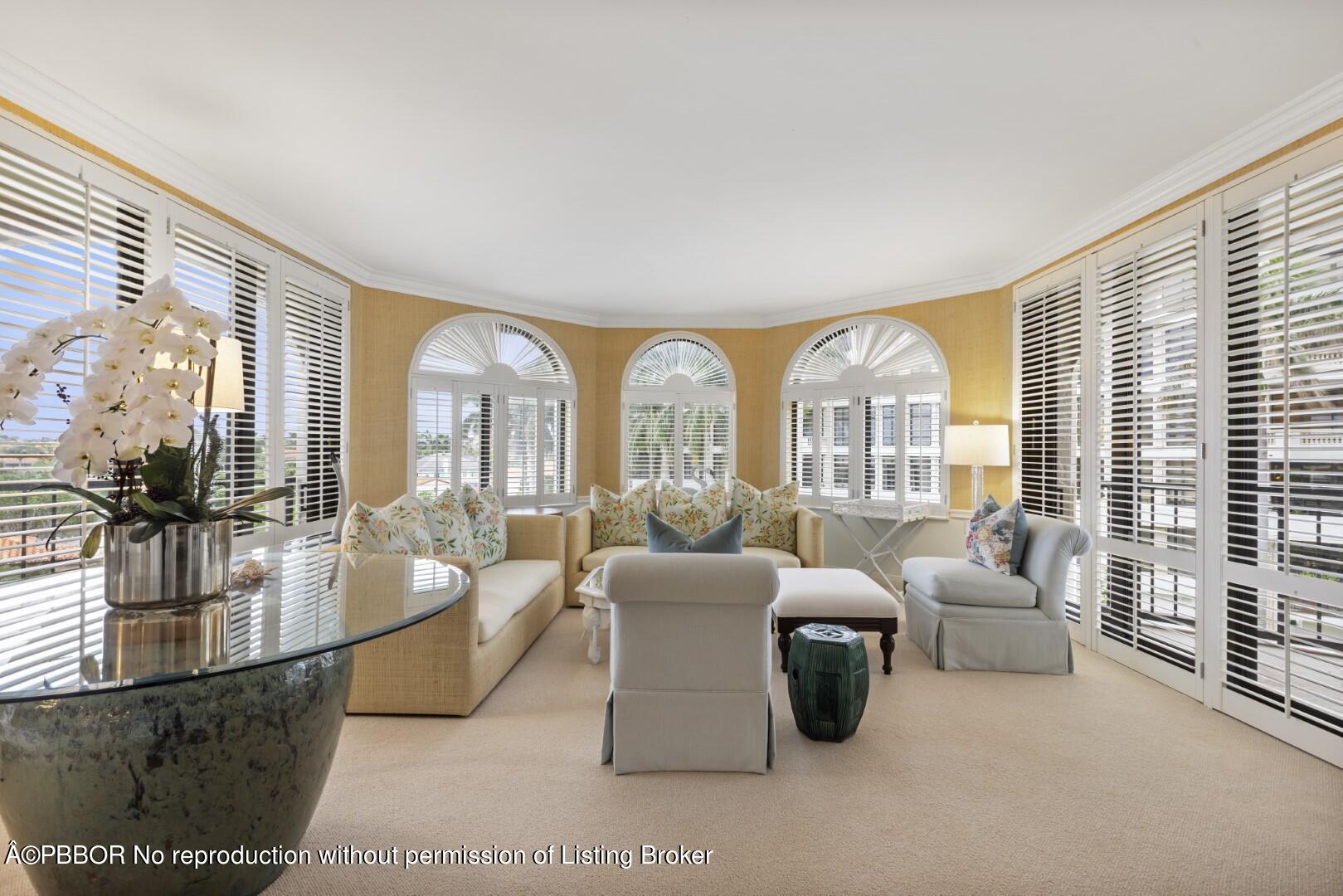 200 Bradley Place, Unit 301 Palm Beach, FL 33480 - Photo 2 of 34 a living room with furniture and a large window
