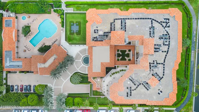 an aerial view of a house with a swimming pool outdoor seating and yard