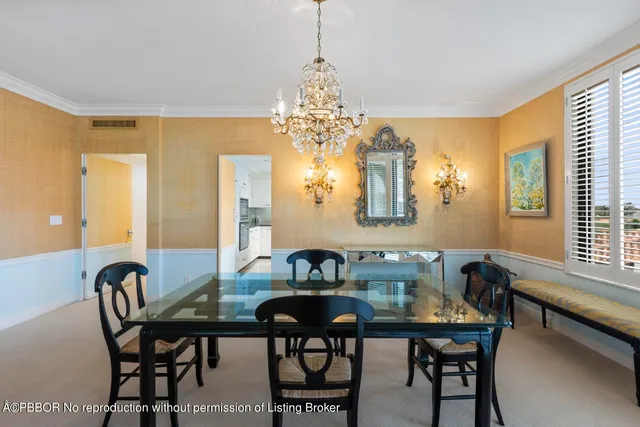 a view of a dining room with furniture and window