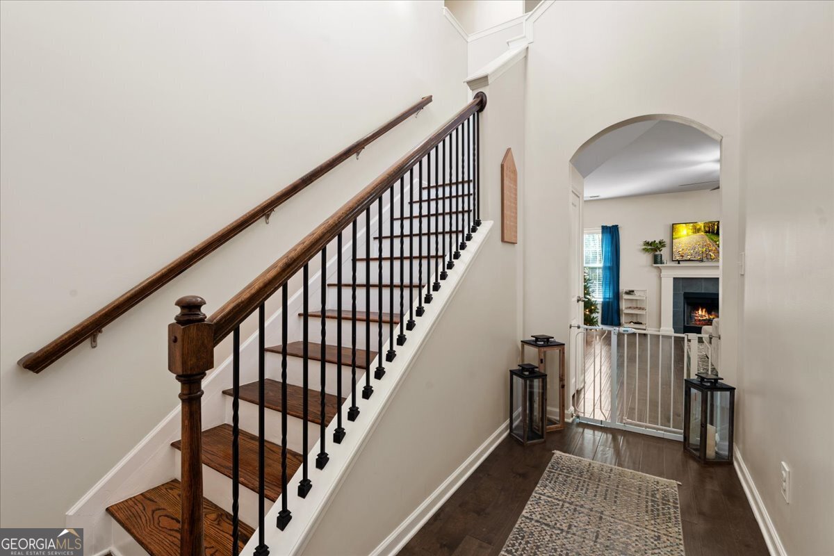 108 East River Cane Run Perry, GA 31069 - Photo 18 of 38 a view of staircase with wooden floor and a rug