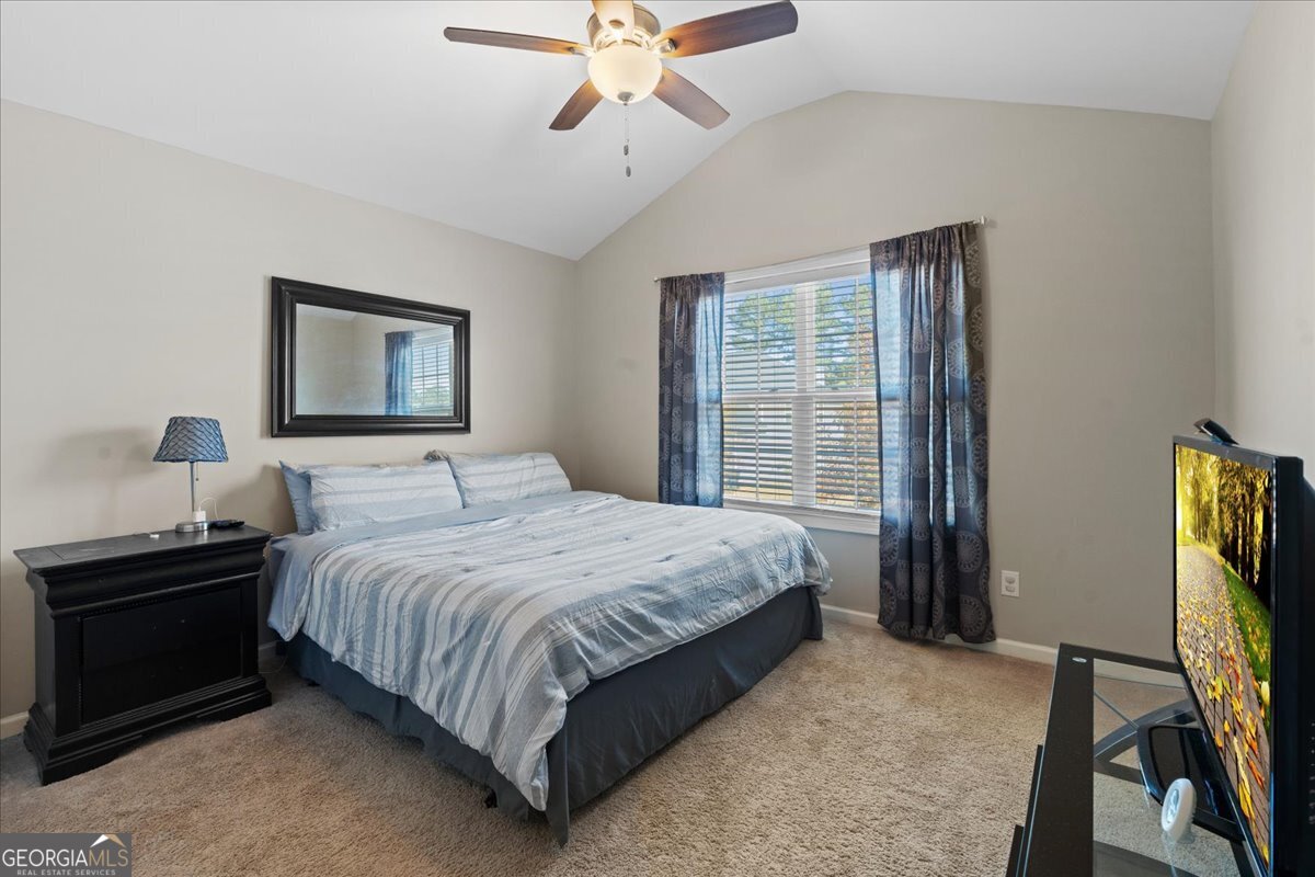 108 East River Cane Run Perry, GA 31069 - Photo 20 of 38 a bedroom with a bed and a window