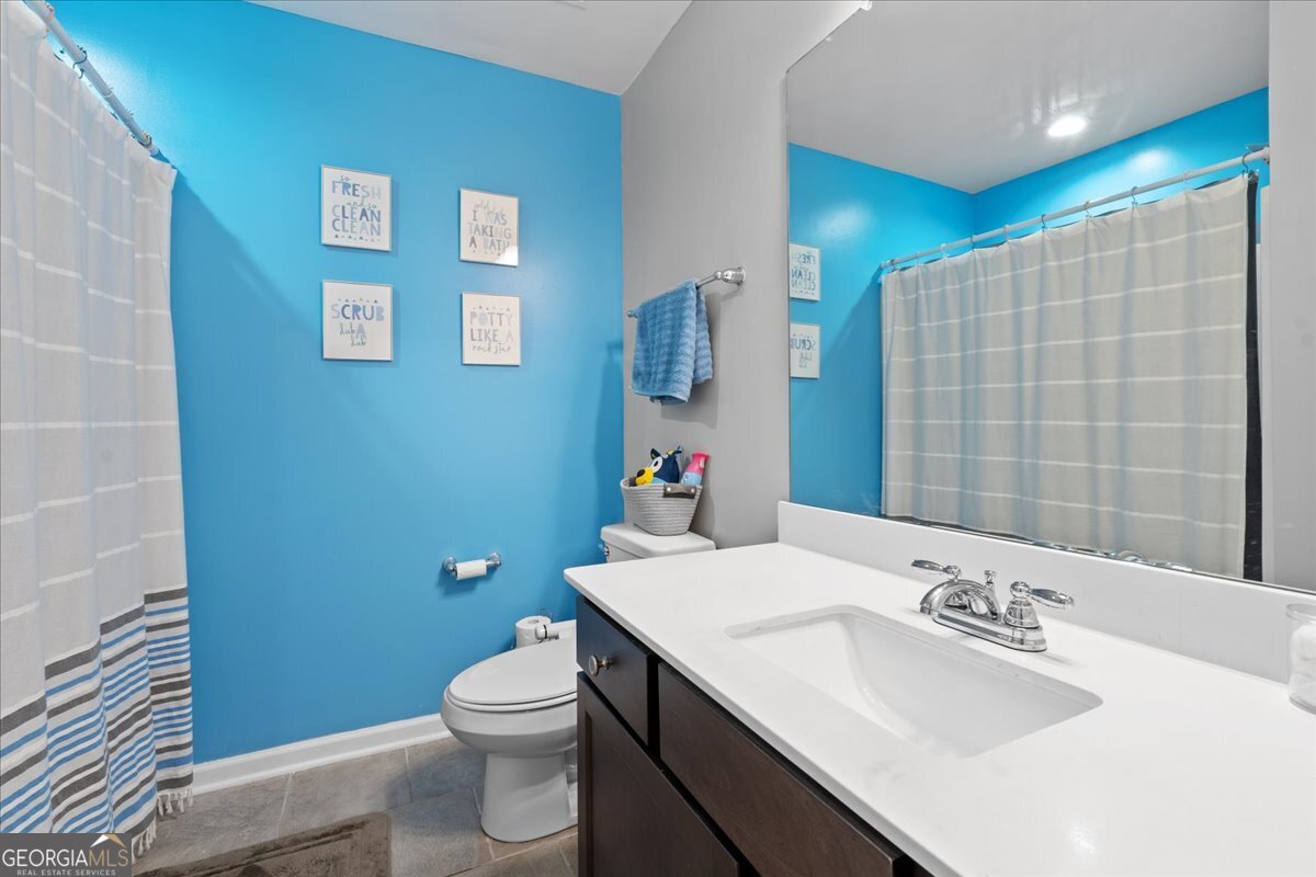 108 East River Cane Run Perry, GA 31069 - Photo 21 of 38 a bathroom with a sink a toilet and shower