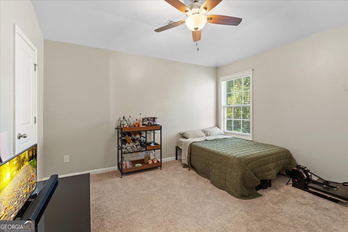 108 East River Cane Run Perry, GA 31069 - Photo 22 of 38 a bedroom with a bed and a window