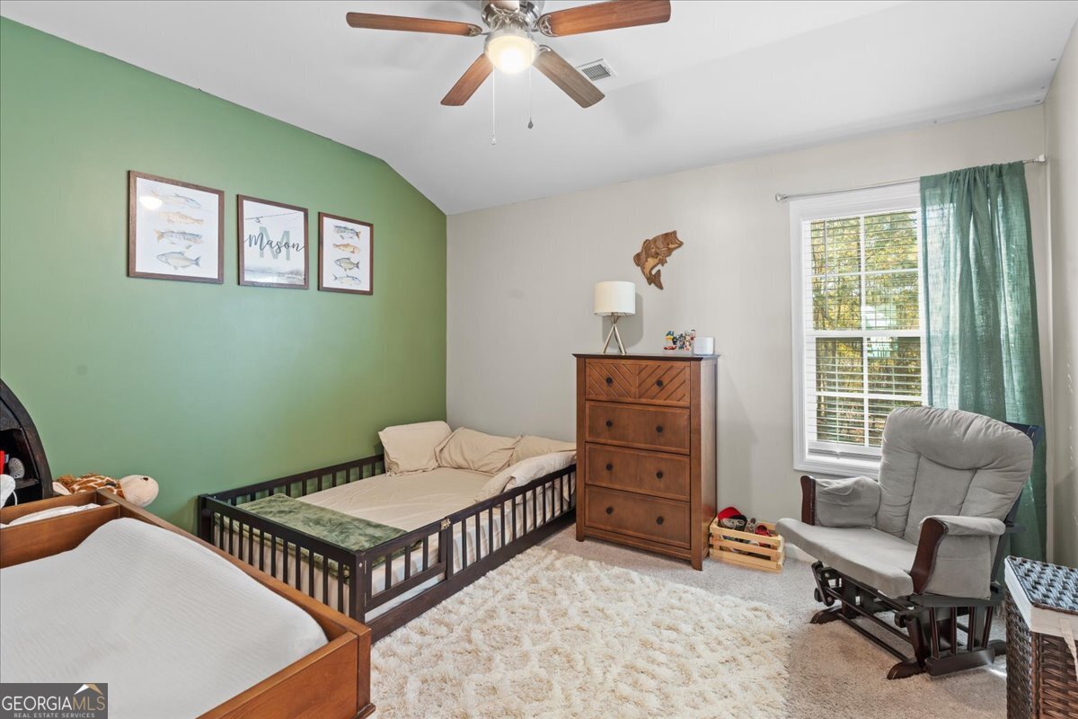 108 East River Cane Run Perry, GA 31069 - Photo 23 of 38 a bedroom with furniture and a window