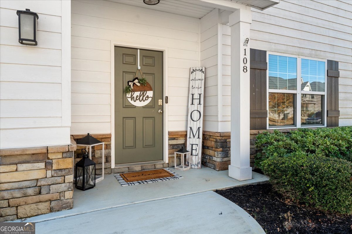 108 East River Cane Run Perry, GA 31069 - Photo 3 of 38 a front view of a house with parking