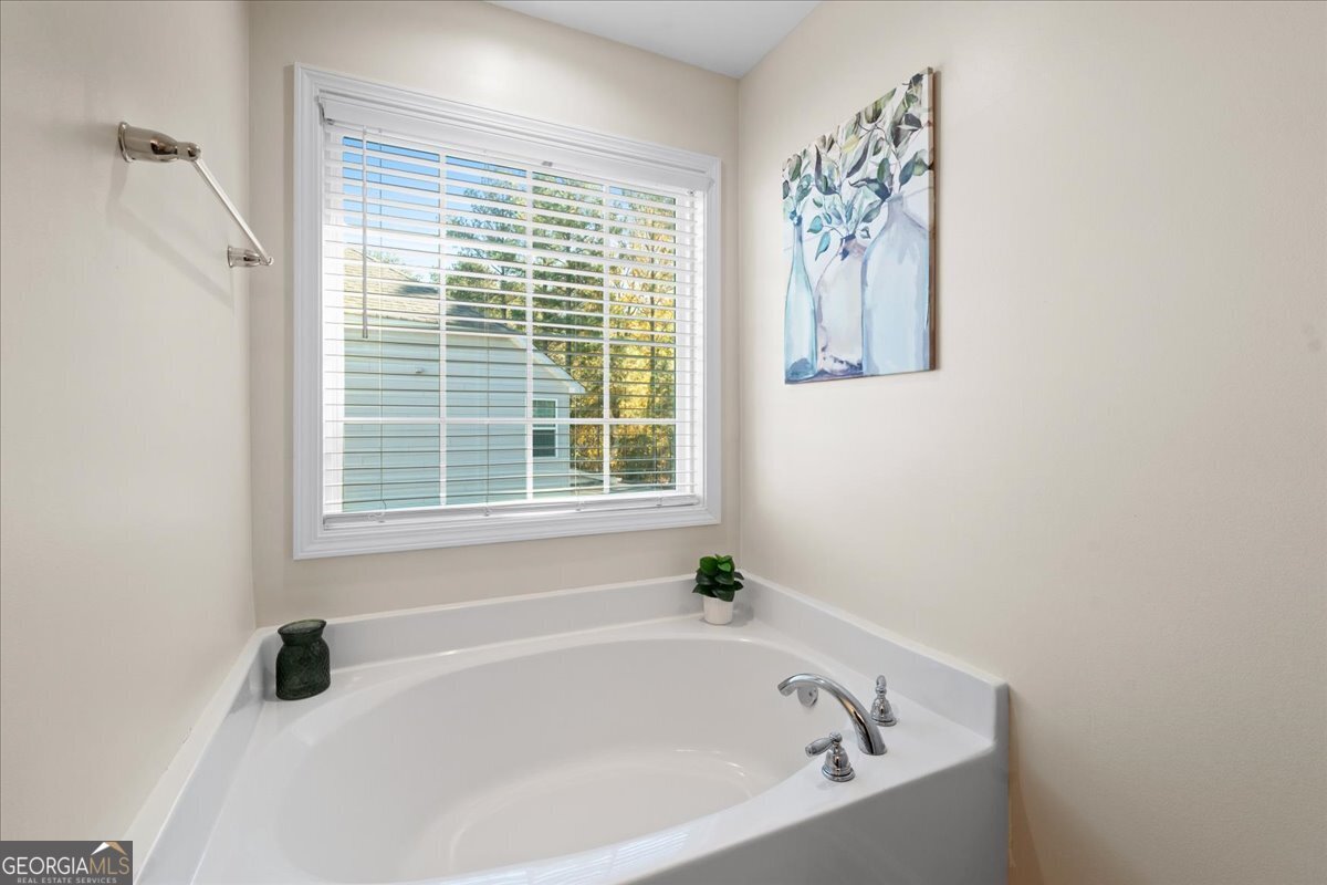 108 East River Cane Run Perry, GA 31069 - Photo 31 of 38 a white bath tub sitting next to a window