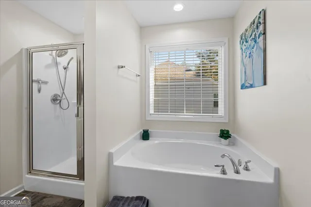 a white bath tub sitting next to a window
