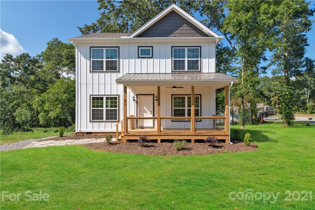 275 Ridge View Drive, Unit 1 Clyde, NC 28721 - Photo 1 of 22 a view of a yard in front of a house