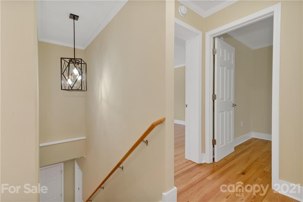 275 Ridge View Drive, Unit 1 Clyde, NC 28721 - Photo 15 of 22 a view of a hallway with wooden floor and stairs