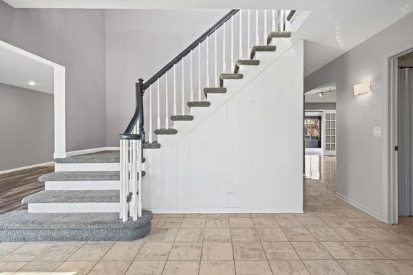 a view of entryway and hall with a rug