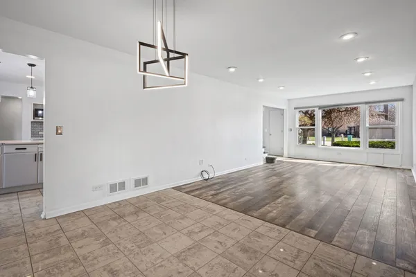 a kitchen with stainless steel appliances a refrigerator sink and cabinets