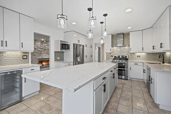 a utility room with cabinets washer and dryer
