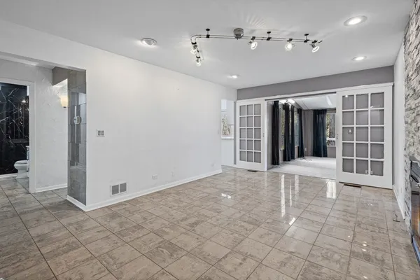 a view of an empty room with a fireplace