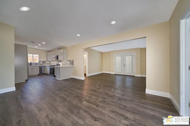 a view of kitchen with wooden floor and windows