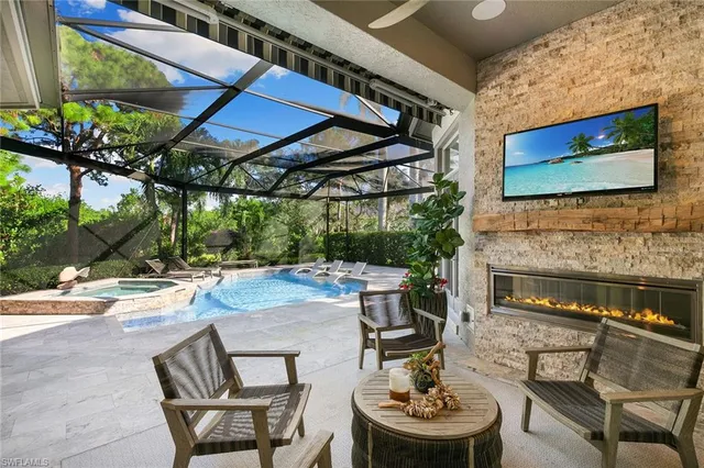 a patio with a table and chairs