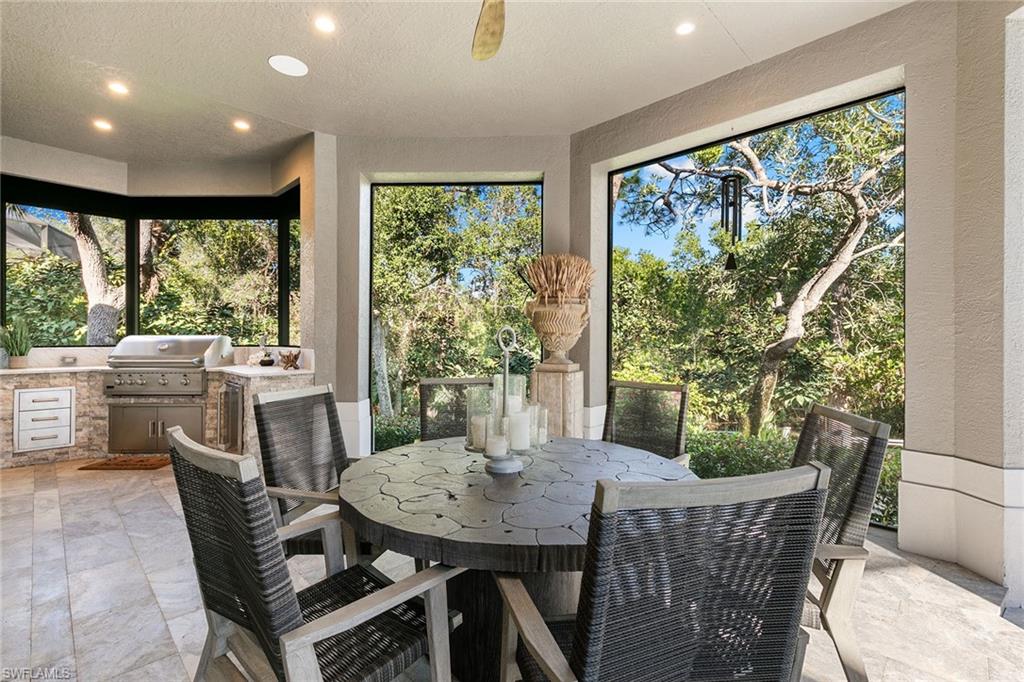 927 Barcarmil Way Naples, FL 34110 - Photo 39 of 48 a view of a dining room with furniture window and outside view