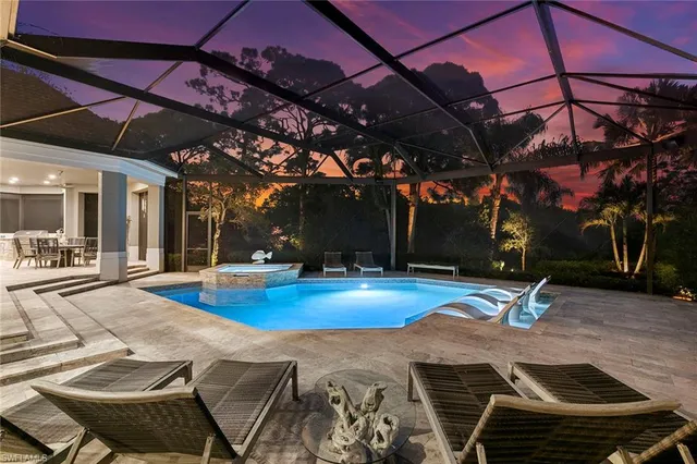 a view of a swimming pool with a patio